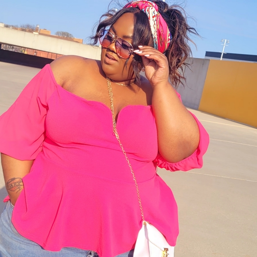 PIINK slightly peplum top